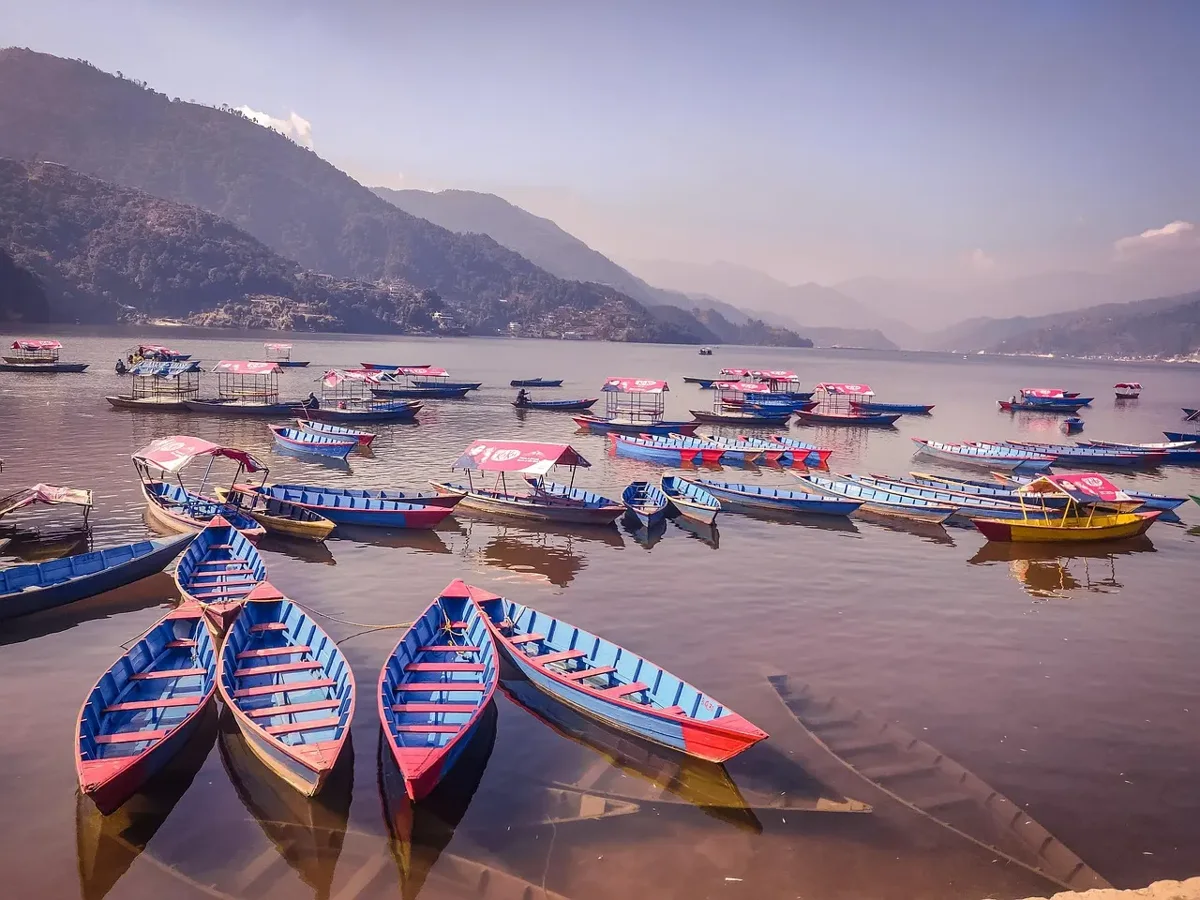 Colourful boats along the shore of Phewa Lake
