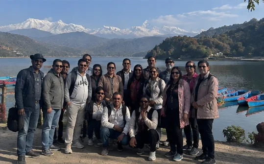 A travel group beside Phewa Lake in Pokhara